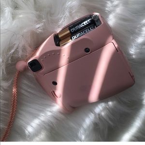 light pink polaroid camera